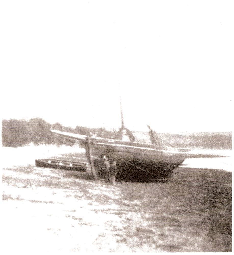 Charlie Trebilcock and Tom Hichens caulking bottom of Trebilcock’s family barge ‘Mary’